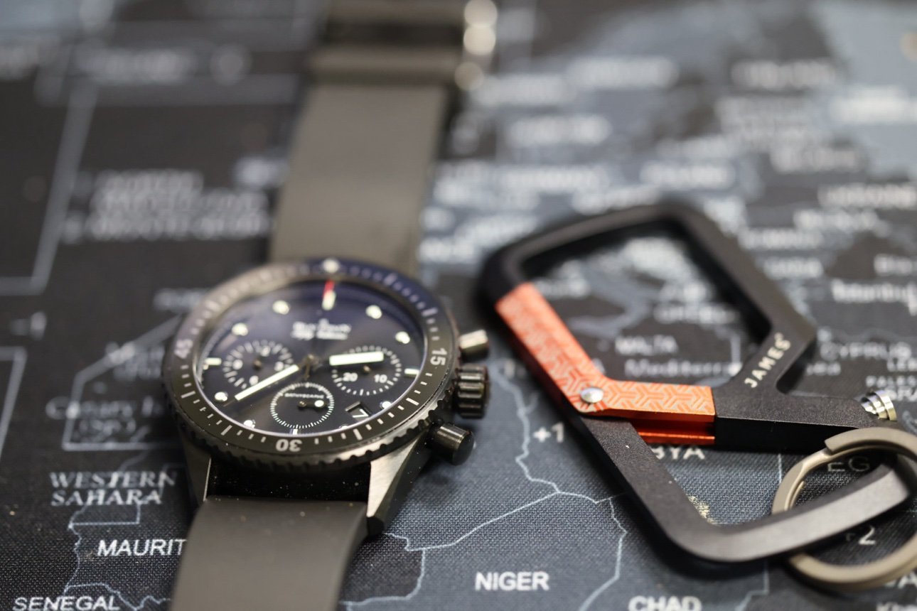 Blancpain Bathyscaphe with everyday carry gear on a map